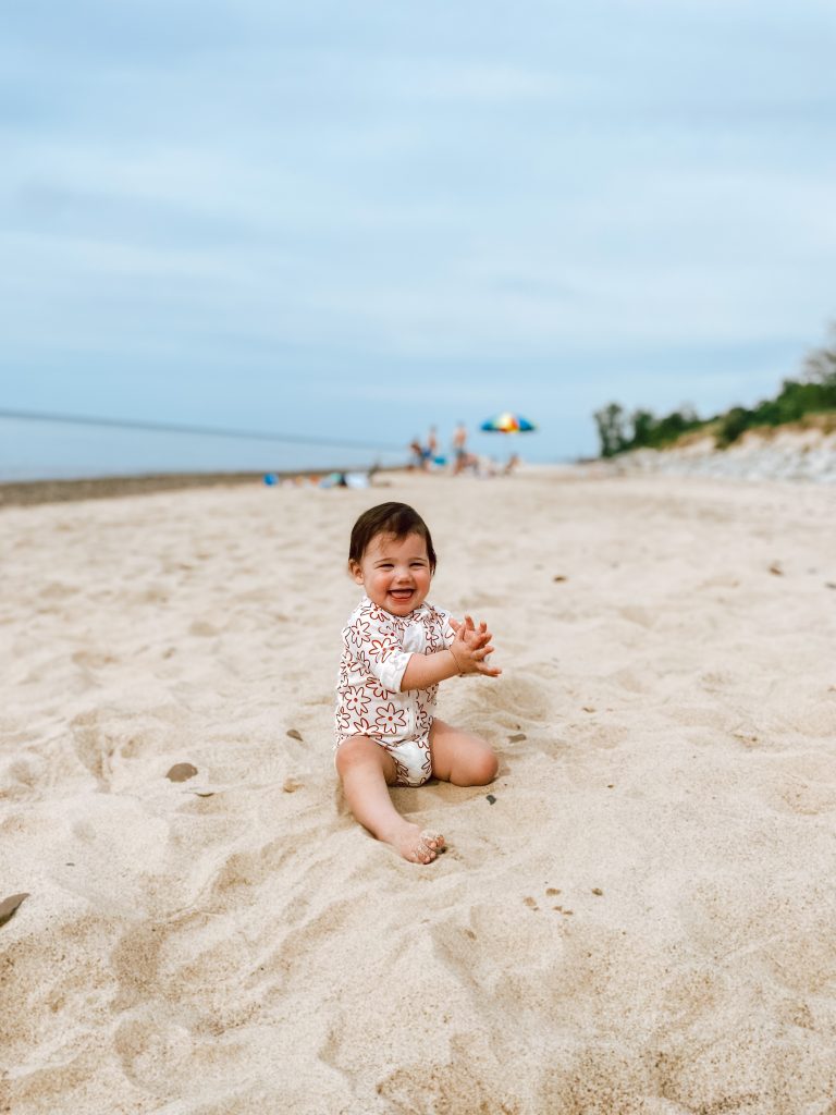 smiling baby in the sand smiling baby in the sand